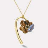 1.82ct Oval Green Tourmaline in Hand Carved Petrified Wood and Chalcedony Large Flora Pendant
