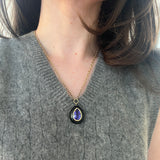 8.46 Pear Tanzanite in Hand Carved Black Jade Lollipop Pendant