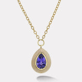 8.46ct Pear Tanzanite in Petrified Wood Lollipop Pendant