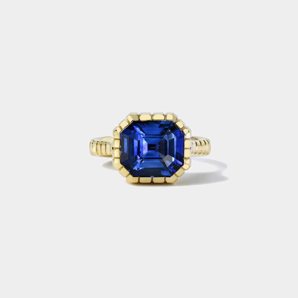 One of a kind 7.53ct Emerald Cut Blue Sapphire Heirloom Bezel Ring